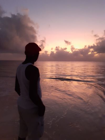 man looking at the sea